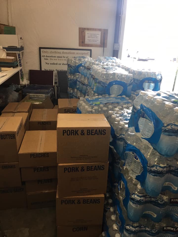 Organized food pantry storage with volunteers